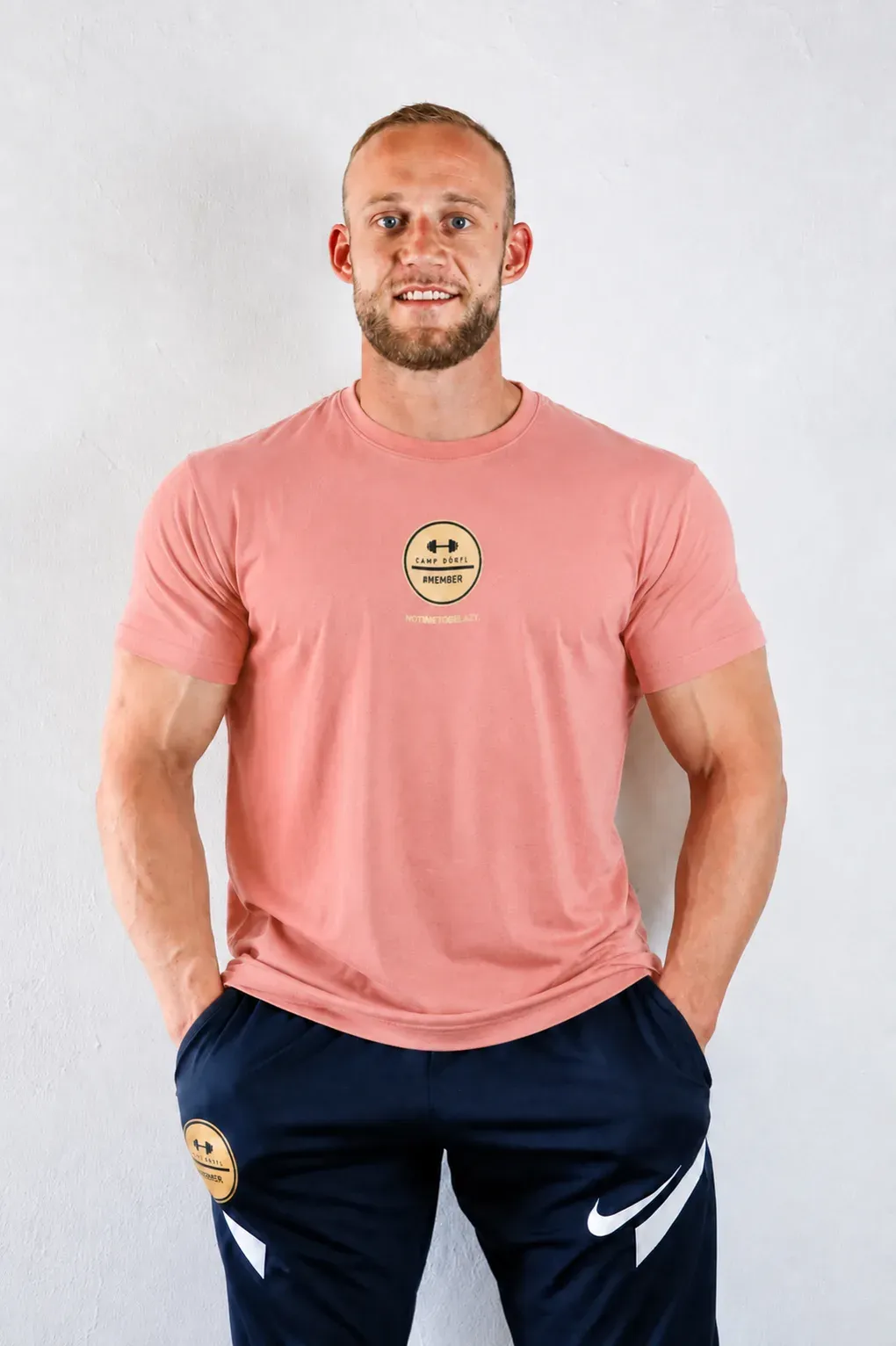 Camp Dörfl shirt in apricot with a gold #MEMBER emblem on the chest