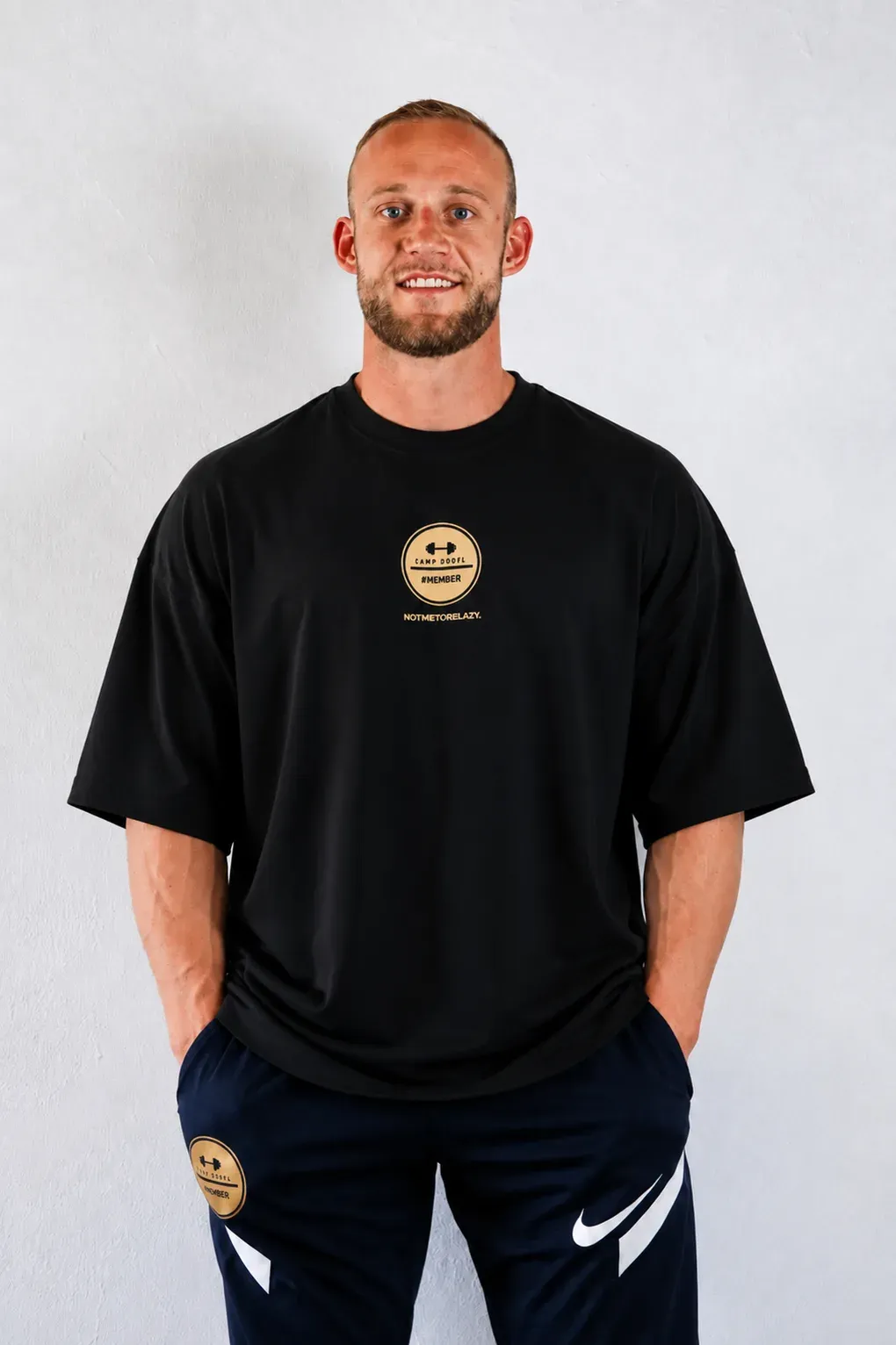 Camp Dörfl shirt in black, oversized cut, with a gold #MEMBER emblem